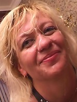 Slutty granny servicing three huge cocks